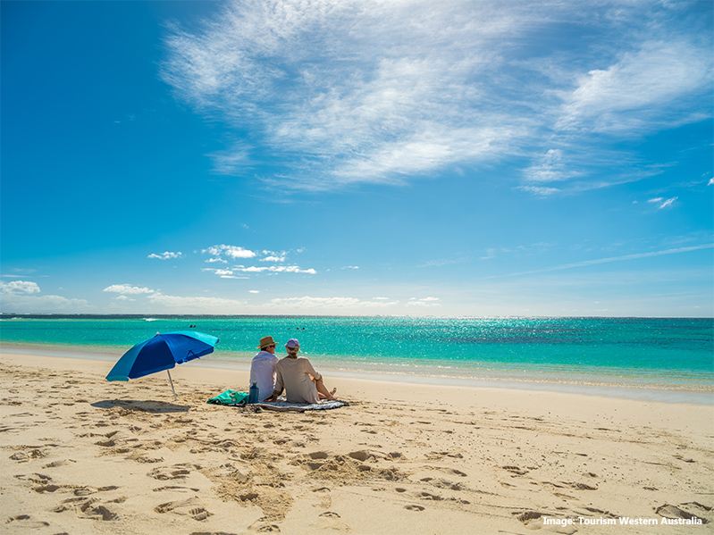 Couple sitting on the sands of Turquoise Bay, Ningaloo Marine Park credit Tourism Western Australia