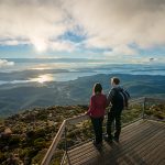 Couple at the summit of kunanyi Mt Wellington in Hobart
